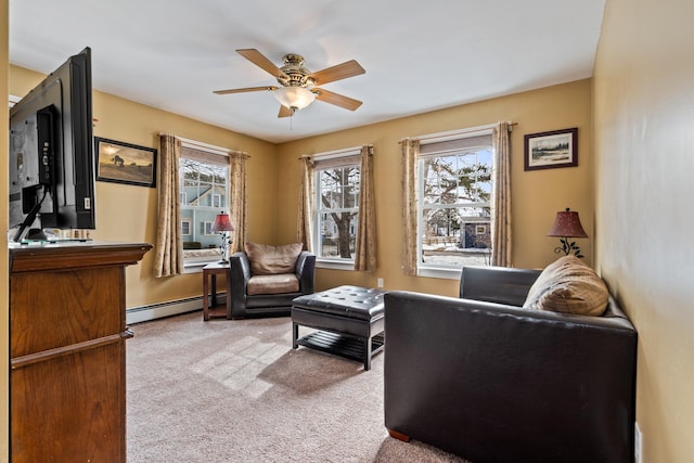 10 Seaside Ave, Saco, ME 04072 - living area with baseboard heating, a ceiling fan, and carpet flooring