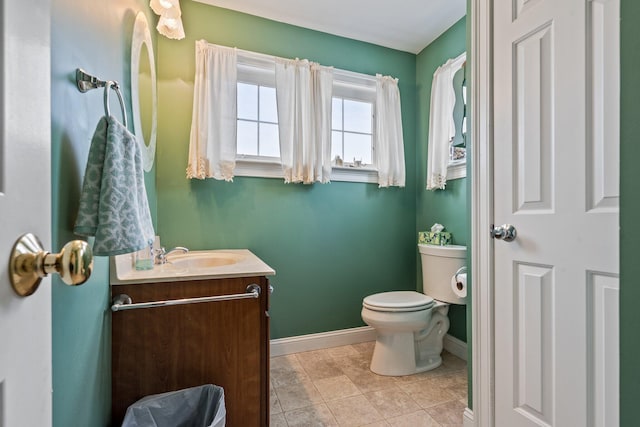 10 Seaside Ave, Saco, ME 04072 - bathroom featuring baseboards, toilet, vanity, and tile patterned flooring