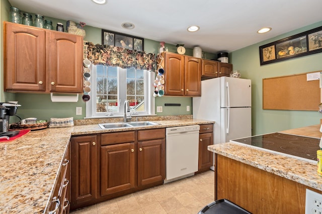 10 Seaside Ave, Saco, ME 04072 - kitchen with white dishwasher, a sink, recessed lighting, light tile patterned floors, and brown cabinets