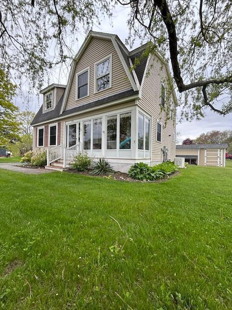 10 Seaside Ave, Saco, ME 04072 - dutch colonial featuring a gambrel roof and a front lawn