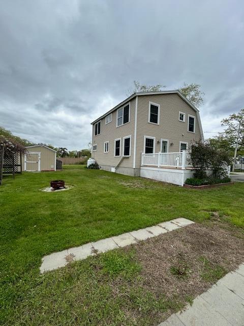 10 Seaside Ave, Saco, ME 04072 - back of house with a fire pit and a yard