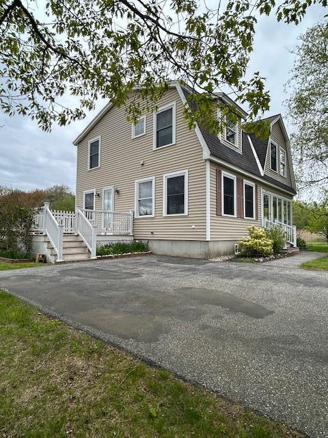 10 Seaside Ave, Saco, ME 04072 - view of front of property featuring driveway and a deck