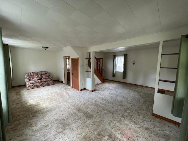 unfurnished living room with carpet