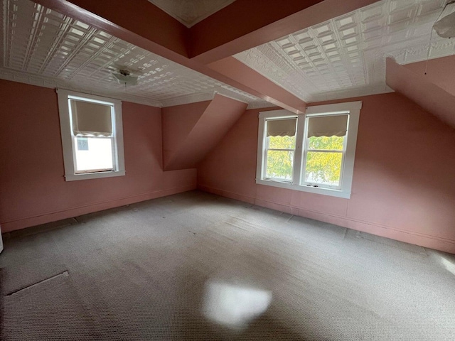 bonus room featuring carpet and a healthy amount of sunlight