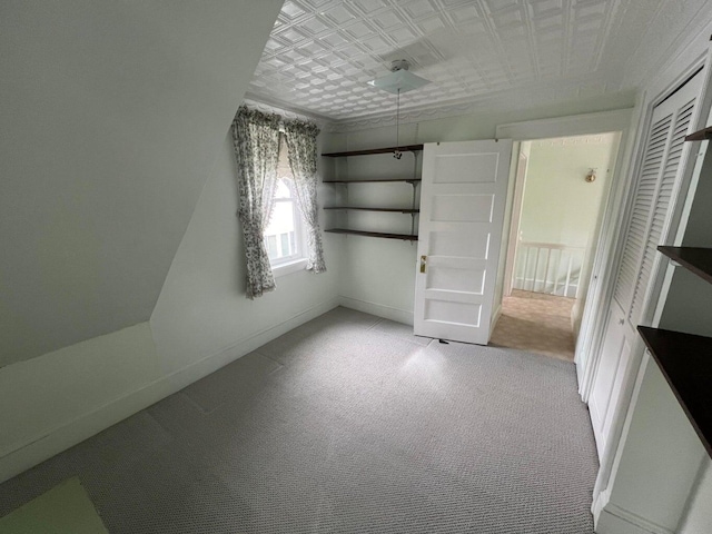 spare room featuring light colored carpet