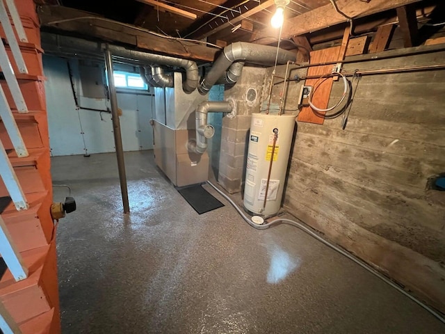 basement featuring gas water heater and heating unit