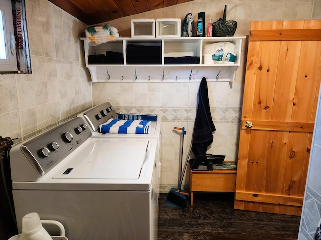 laundry area featuring washer and dryer, tile walls, and wood ceiling