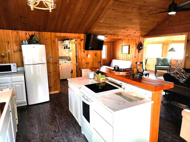 kitchen featuring a center island, white appliances, washer / dryer, white cabinetry, and wood ceiling