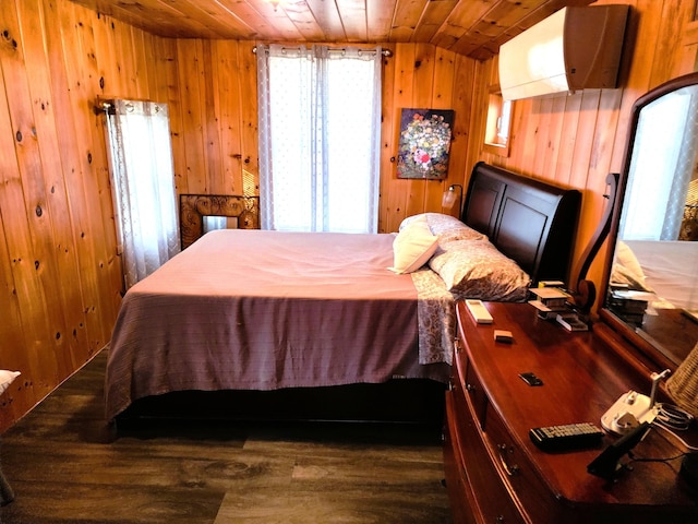 bedroom with wood ceiling, dark wood-type flooring, and wooden walls