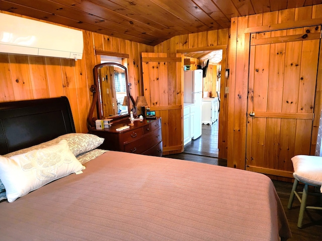 bedroom featuring wood walls, white refrigerator, vaulted ceiling, wood ceiling, and a wall unit AC