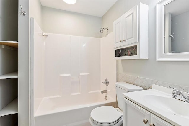 full bathroom featuring vanity,  shower combination, and toilet