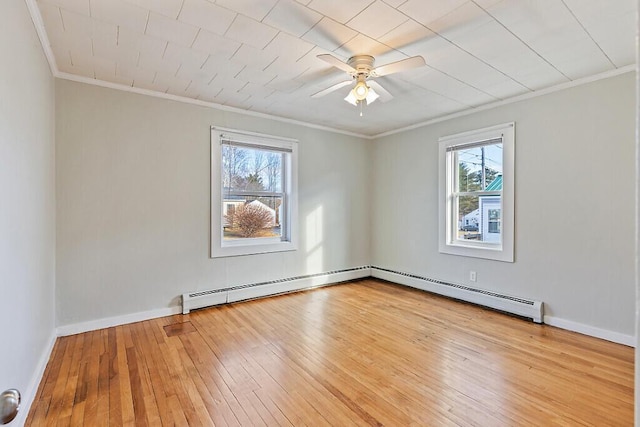 unfurnished room featuring baseboard heating, crown molding, ceiling fan, and light wood-type flooring