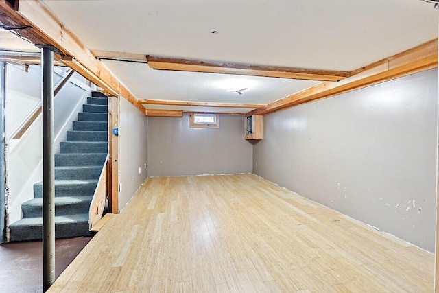 basement featuring hardwood / wood-style floors