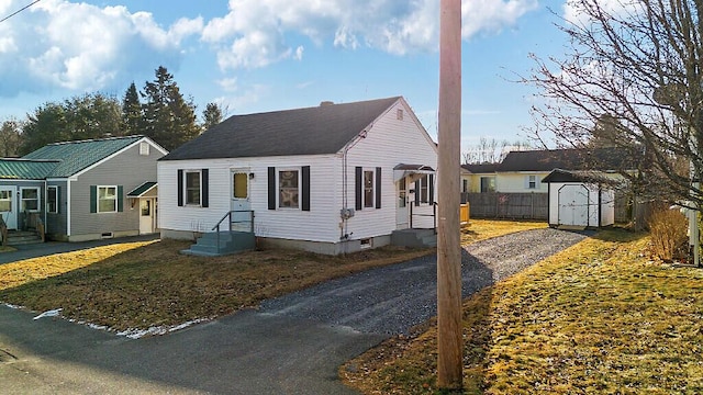 view of front of house featuring a shed