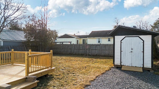 view of yard with a storage unit and a wooden deck