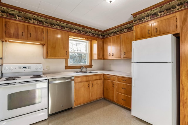 kitchen featuring white appliances and sink