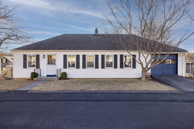 ranch-style home featuring a garage