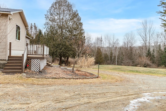 view of yard featuring a wooden deck