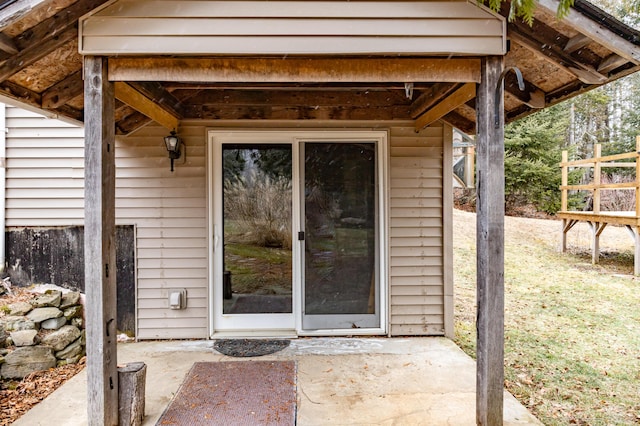 entrance to property featuring a patio area