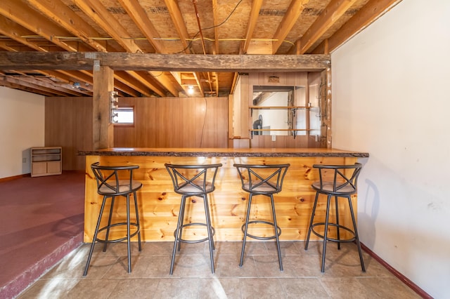 bar featuring wooden walls