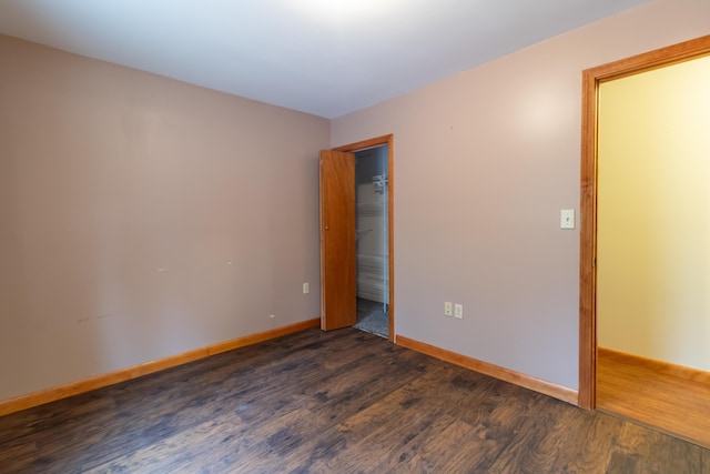 empty room featuring dark hardwood / wood-style floors