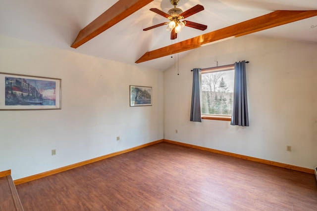 spare room with ceiling fan, wood-type flooring, and vaulted ceiling with beams