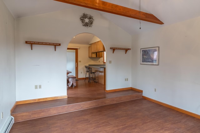 unfurnished room featuring a baseboard heating unit, dark hardwood / wood-style floors, and lofted ceiling with beams