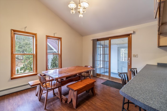 dining area featuring high vaulted ceiling, dark hardwood / wood-style floors, and an inviting chandelier