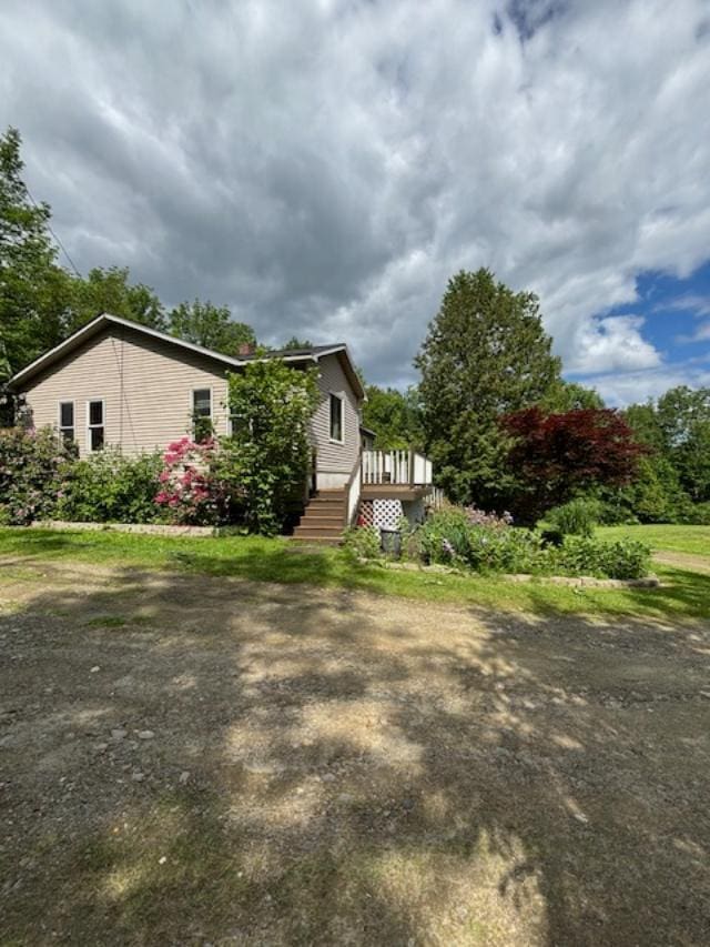 view of front of house featuring a wooden deck