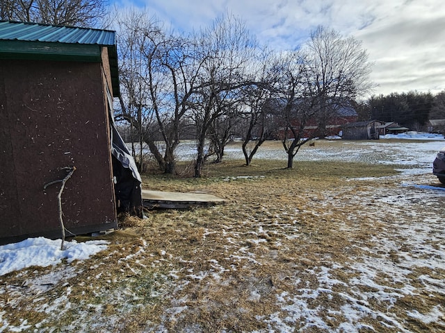 view of yard layered in snow