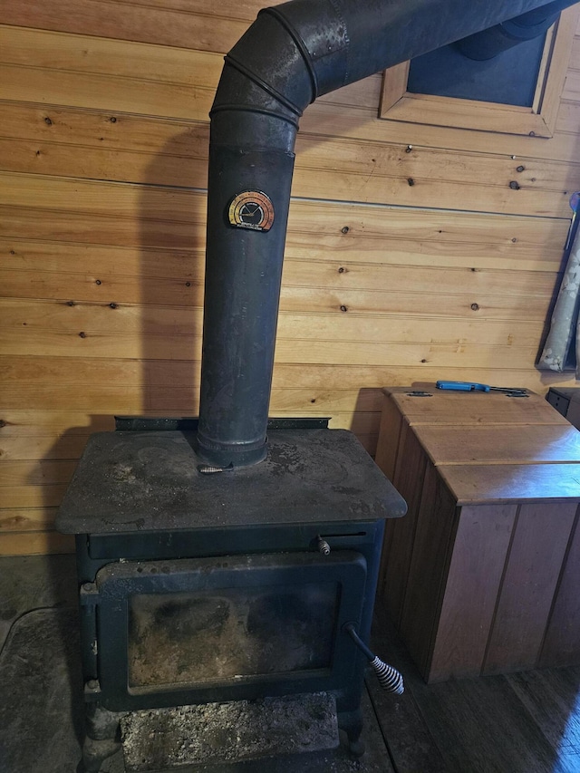 details with a wood stove and wood walls