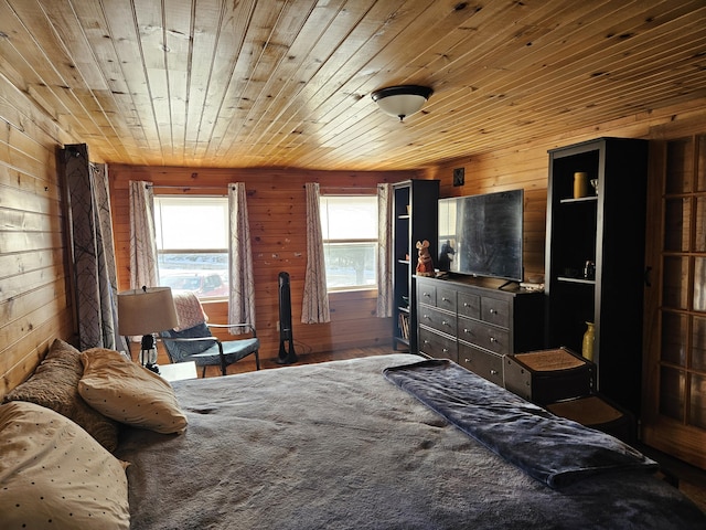 bedroom with wooden walls and wood ceiling