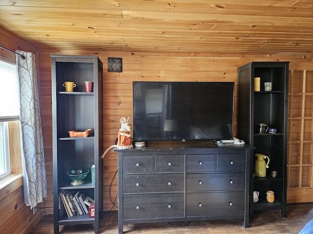 living room featuring wooden ceiling and wood walls