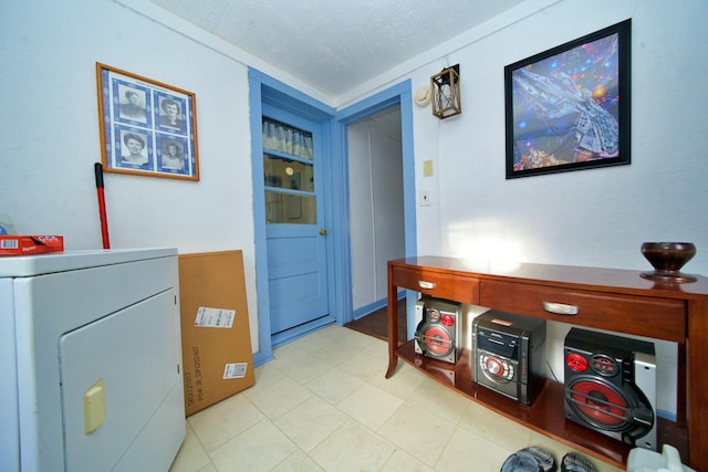 interior space with washer / clothes dryer and a textured ceiling