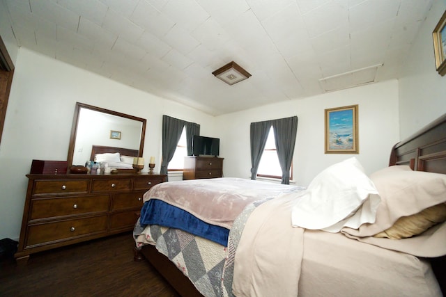 bedroom featuring dark wood-type flooring