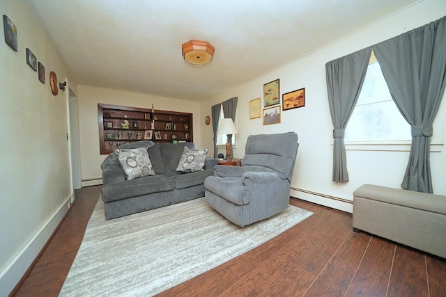 living room with baseboard heating and hardwood / wood-style floors