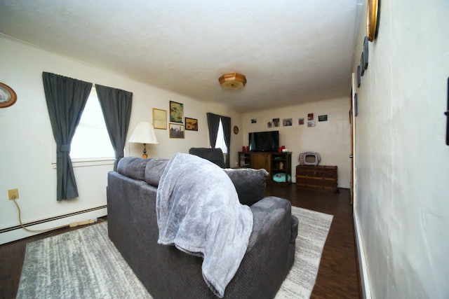 living room featuring dark hardwood / wood-style flooring and baseboard heating