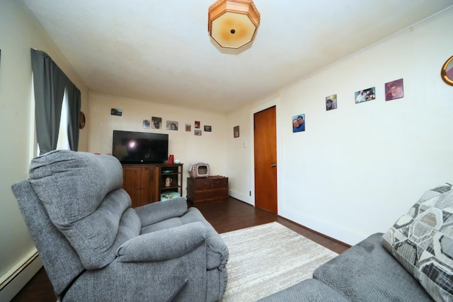 living room with a baseboard radiator and dark hardwood / wood-style flooring