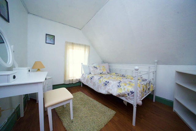 bedroom featuring lofted ceiling and dark wood-type flooring