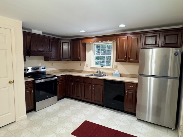 kitchen featuring appliances with stainless steel finishes, dark brown cabinetry, custom range hood, and sink