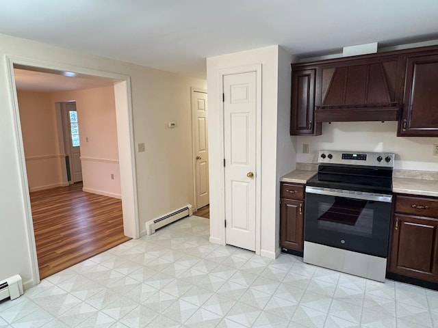 kitchen featuring dark brown cabinets, baseboard heating, stainless steel electric stove, and custom exhaust hood