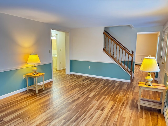 interior space featuring hardwood / wood-style floors and a baseboard radiator