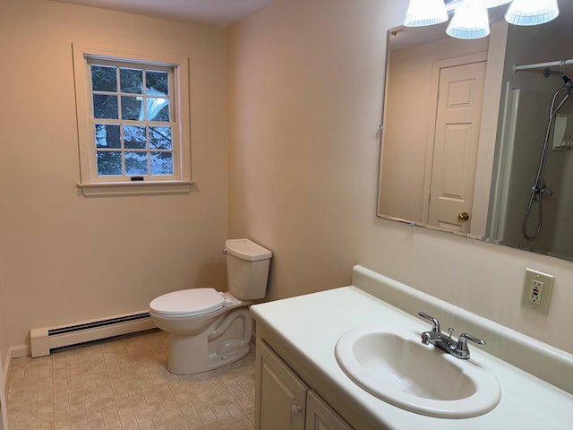 bathroom with vanity, a baseboard radiator, and toilet