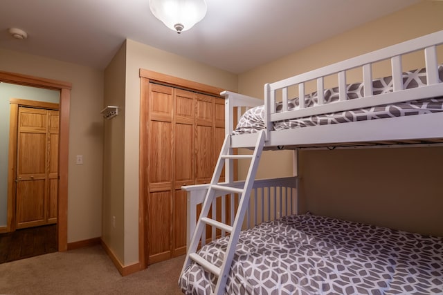 carpeted bedroom with a closet