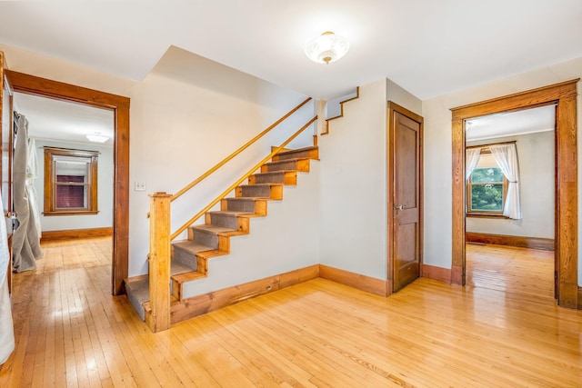 stairs with wood-type flooring