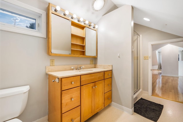 bathroom featuring an enclosed shower, toilet, vaulted ceiling, and vanity