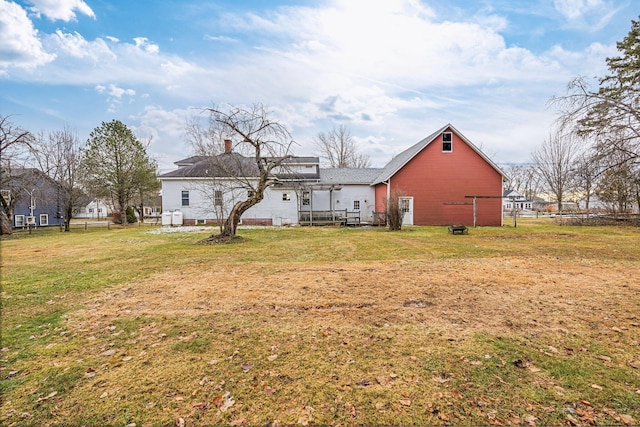 back of house with a yard