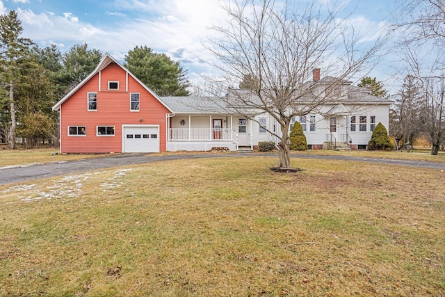 view of front of home featuring a garage and a front yard