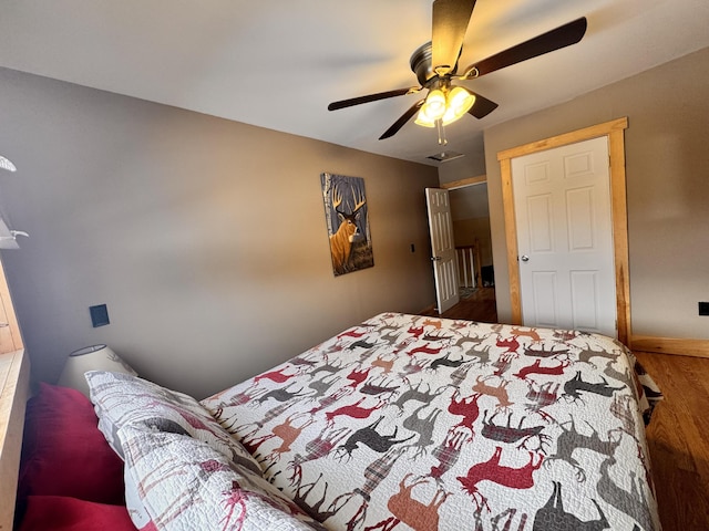 bedroom featuring ceiling fan and hardwood / wood-style floors