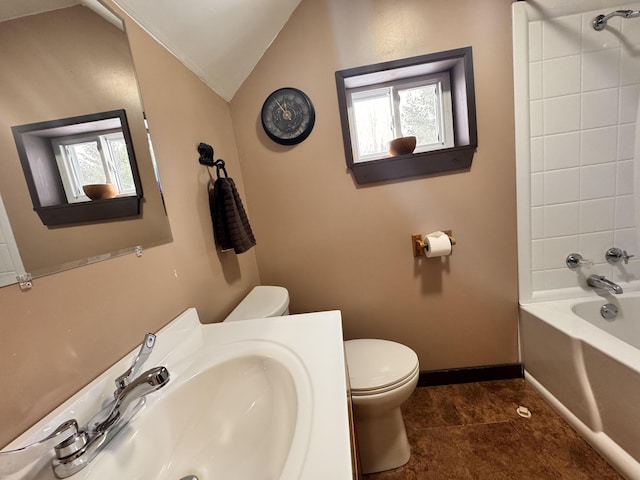 full bathroom featuring sink, toilet, lofted ceiling, and shower / bathing tub combination